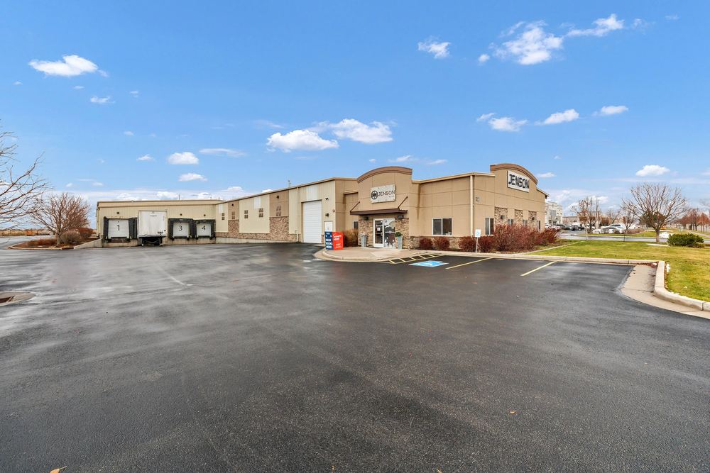 Exterior of the Jenson Storage facility with loading bays in Logan, Utah